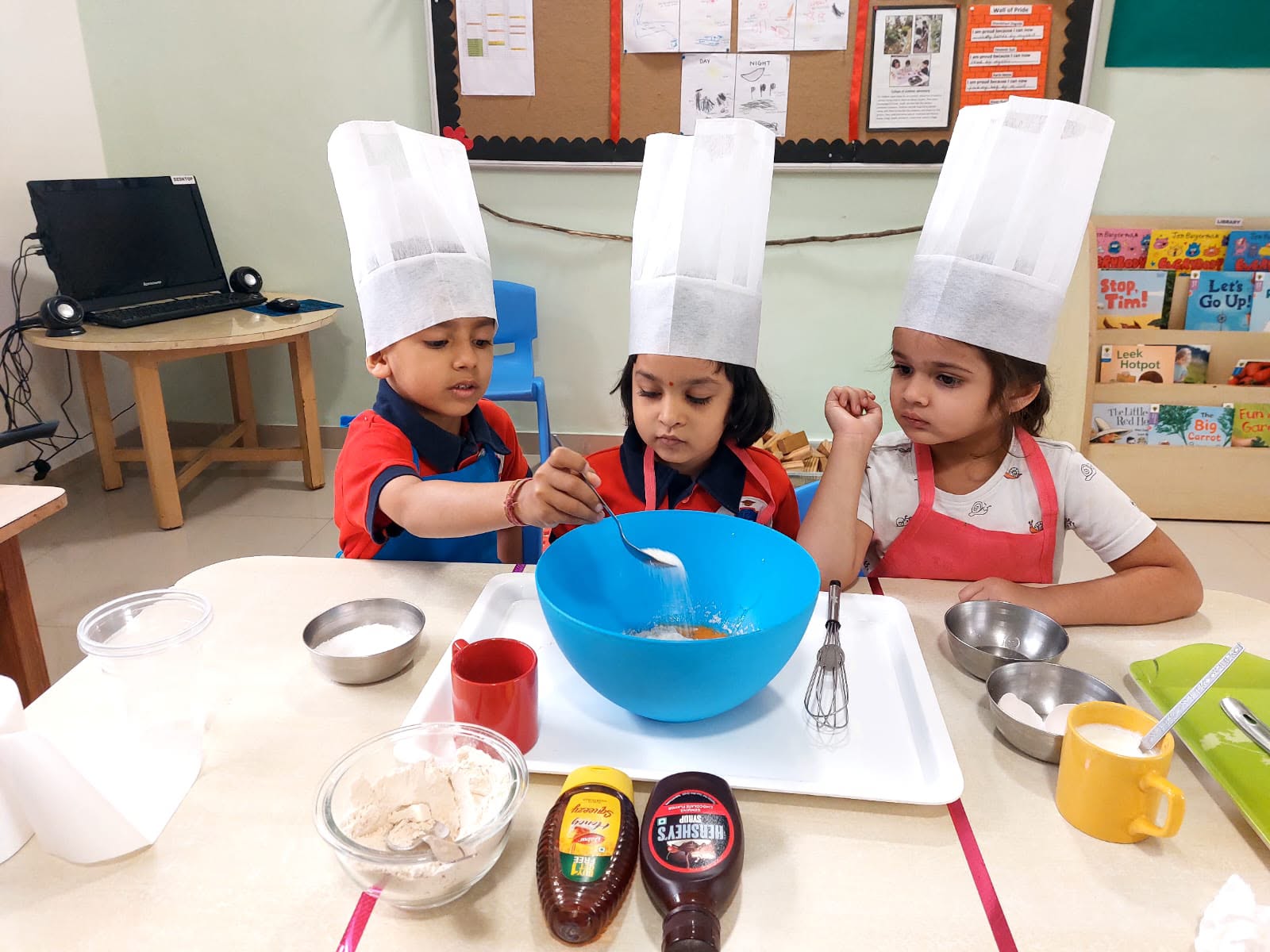 Toddler developing fine motor and sensory skills with colorful blocks at Damara International preschool Pune
