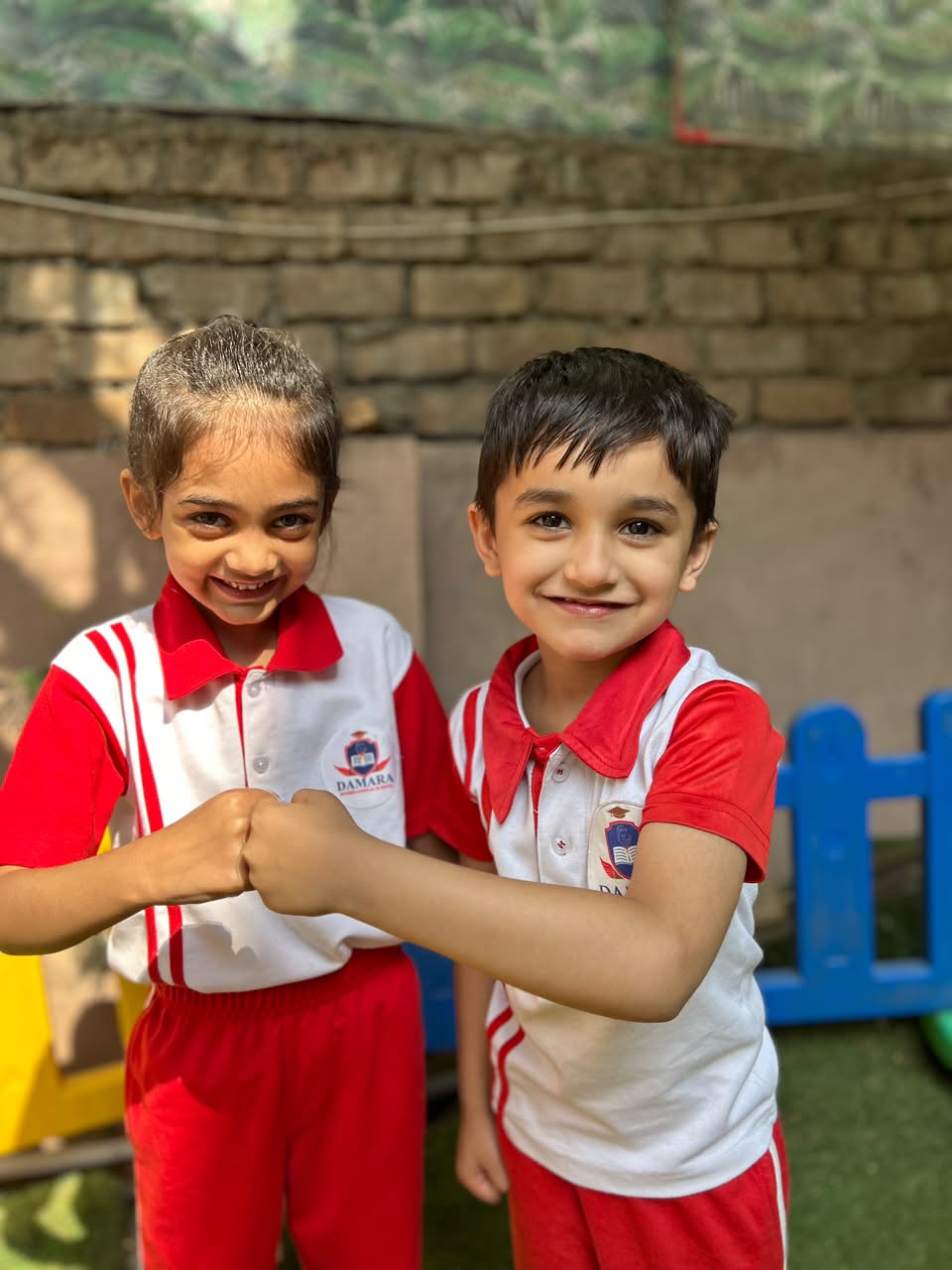 Children collaborating during a joyful interactive storytelling circle at Damara Pune