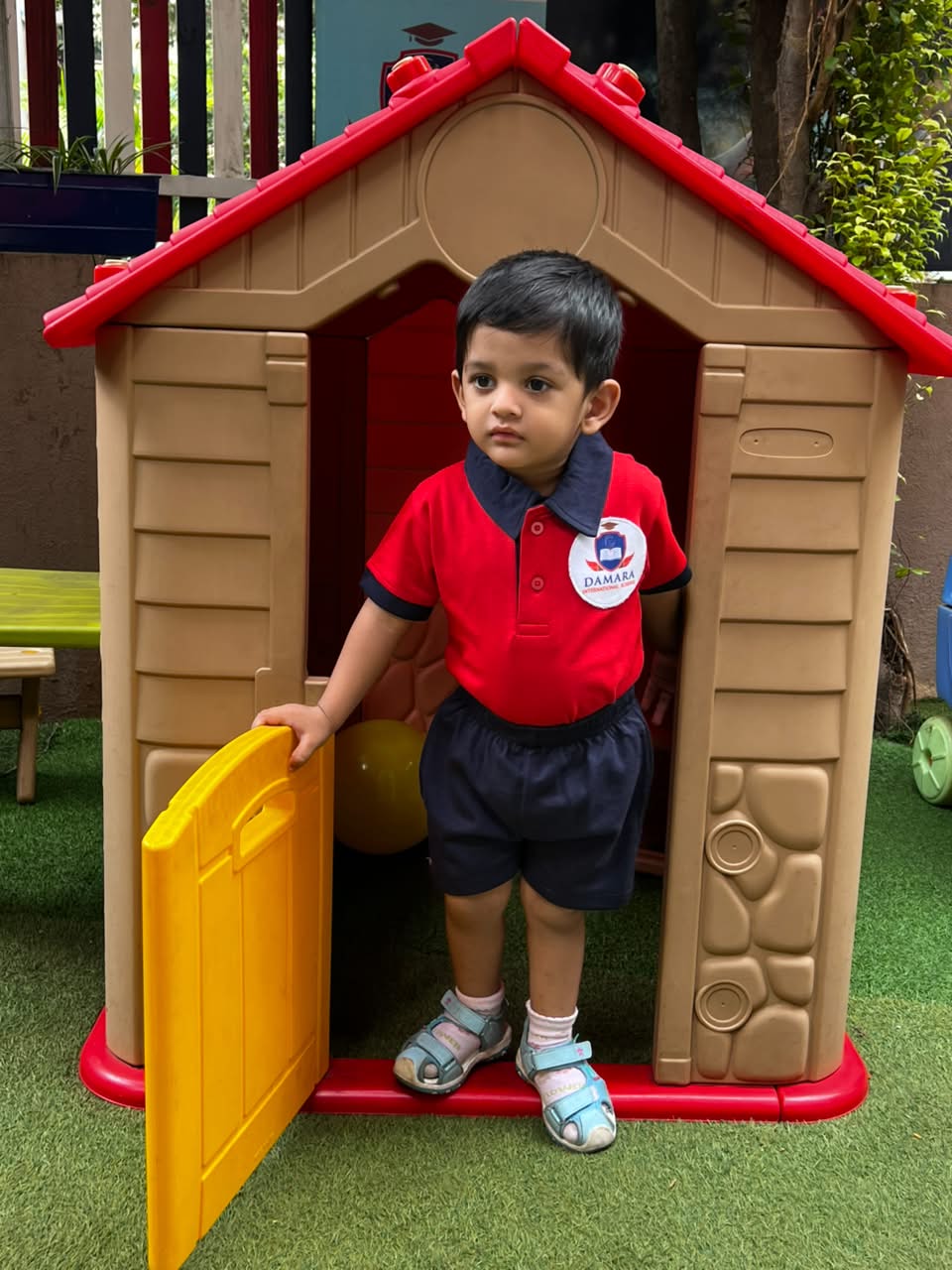 Happy toddler enjoying safe indoor play gym and soft learning equipment at Damara Pune