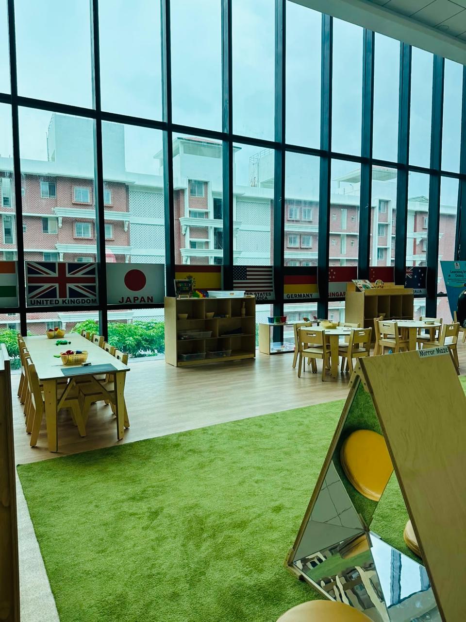 Spacious AC modern preschool classroom with child-friendly wooden furniture at Damara NIBM Undri