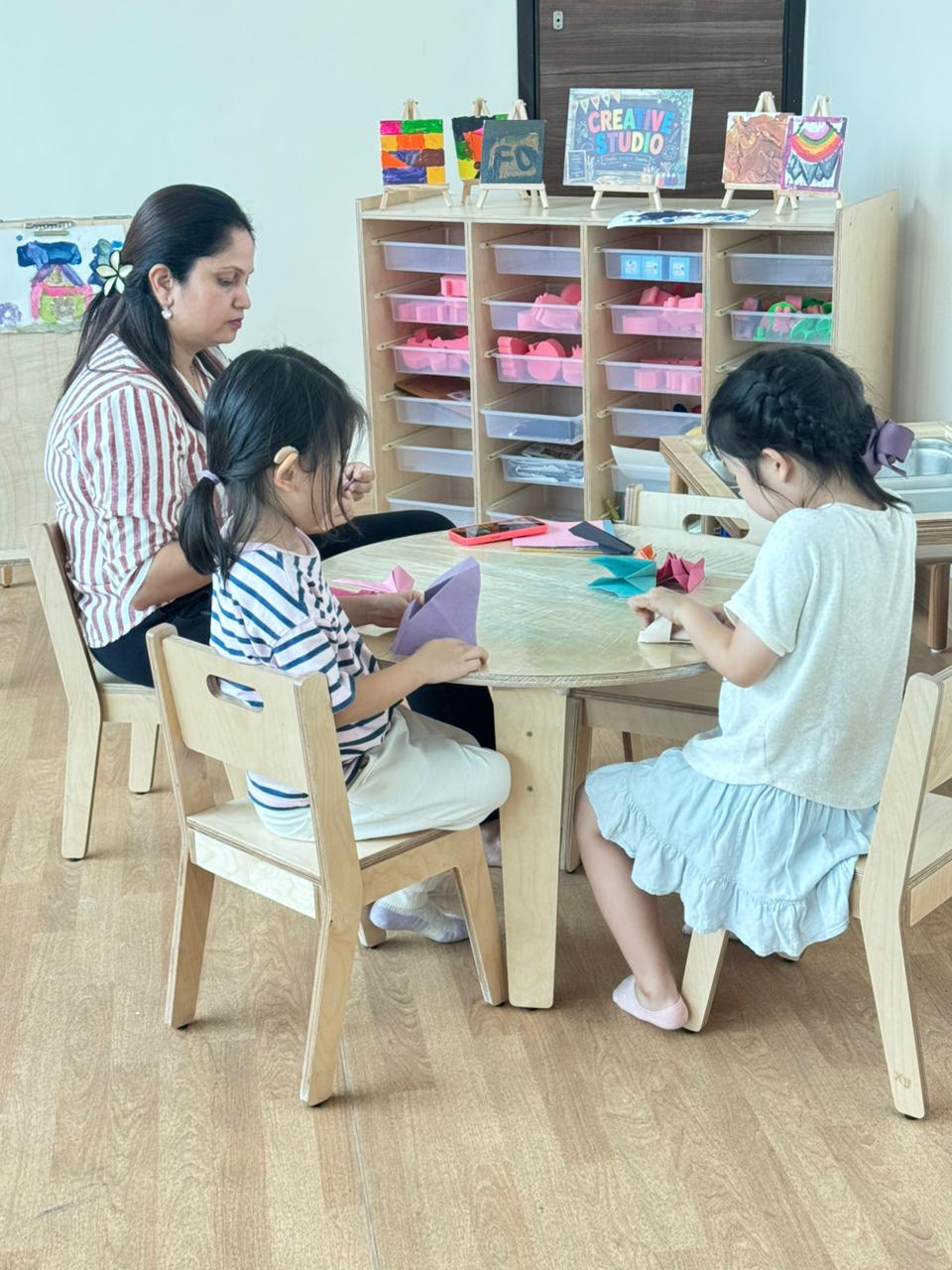 Young students learning teamwork and communication during creative construction play Pune