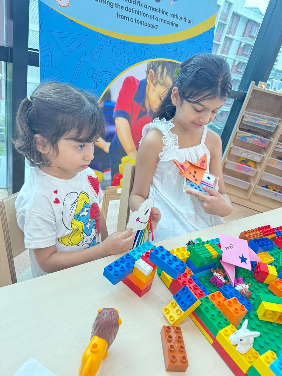 Toddler learning shapes and spatial awareness with sorting puzzles at Damara daycare Pune